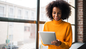 Smiling woman on tablet